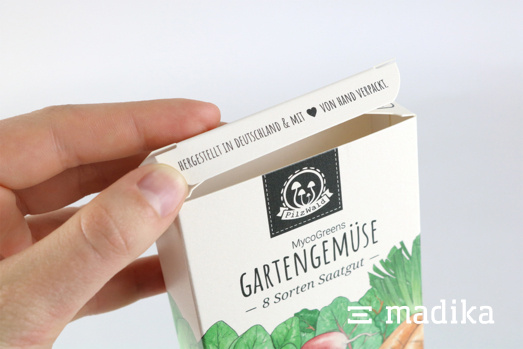 Eine kleine Faltschachtel mit dem Gartengemüse Aufdruck Eine kleine Faltschachtel mit dem Gartengemüse Aufdruck